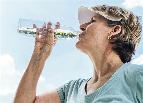 Senior Woman Drinking From Water Bottle Aw Health Care