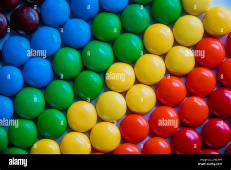 Brightly Colored Sweet Candies Laying Flat Rainbow Candy Background