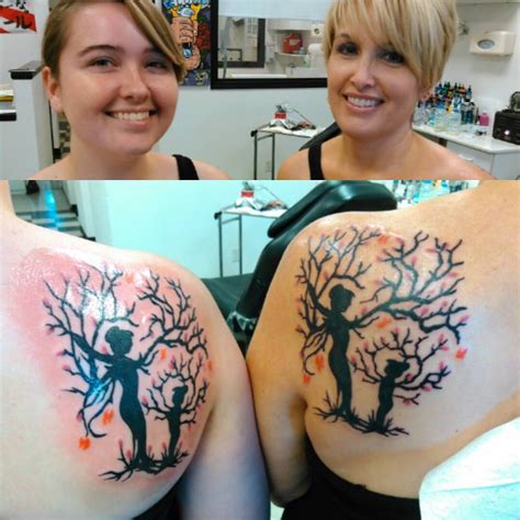 Two Women With Tattoos On Their Arms One Has A Tree And The Other Has