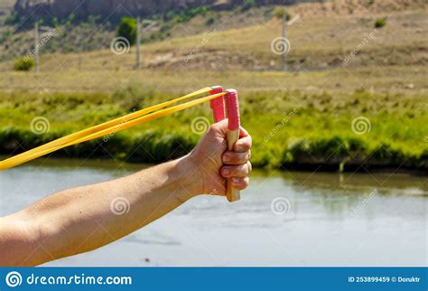 Man Using Spear Thrower Throwing Rock Nature Amusement Stock Image Image Of Black Event