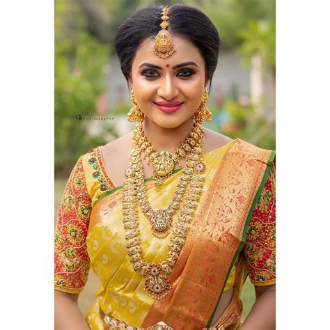 In A Bridal Look In Yellow Color Pattu Kanjeevaram Saree Elbow Length Sleeve Blouse