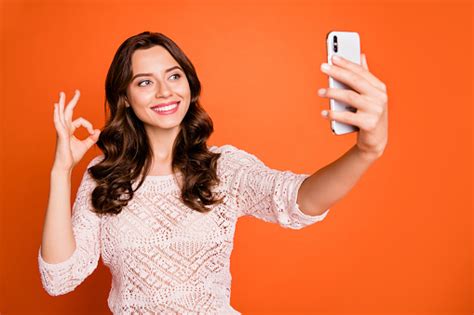 Portrait Of Positive Cheerful Girl Make Selfie With Her Cell Phone