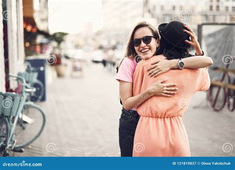Outgoing Woman Embracing Comrade Outdoor Stock Image Image Of Friend Positive 121819837