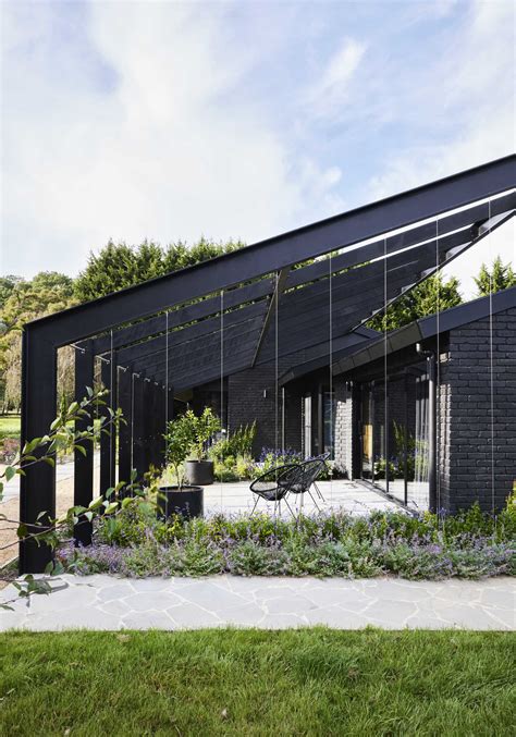 Pitched Roofs Cover This Dark And Moody Farmhouse Archup
