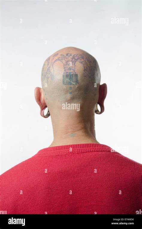 Man With Tattooed Head Facing Away From Camera Stock Photo Alamy