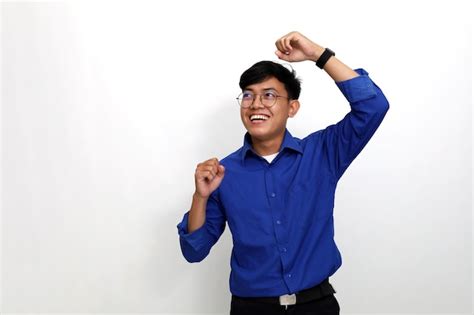 Premium Photo Happy Young Asian Man Standing While Dancing Isolated