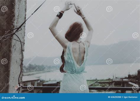 Young Beautiful Woman Dancing On The Roof Closeup Stock Photo Image