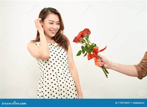 Happy Asian Woman Getting Flowers From Her Boyfriend Stock Image