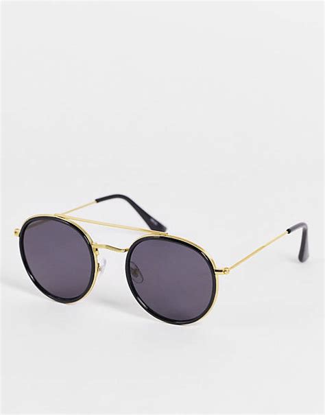 madein round chunky sunglasses in gold and black asos