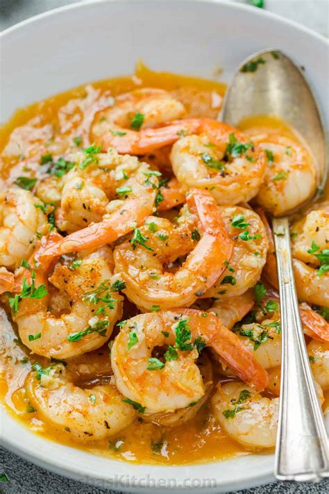 Hand peeled shrimp dishes are plate orange. Shrimp Scampi Recipe - NatashasKitchen.com