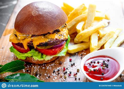 Closeup Of A Delicious Double Cheeseburger With French Fries And