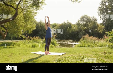 Woman Exercising In Park In The Morning Female Doing Meditation Exercises At Stock Video