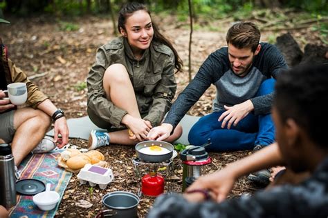 Premium Photo Friends Camping In The Forest Together