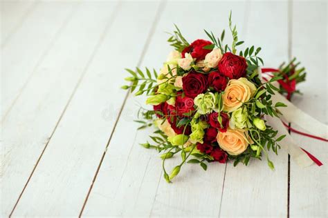 Bridal Bouquet Of Red Roses With Red Satin Ribbons Stock Photo Image