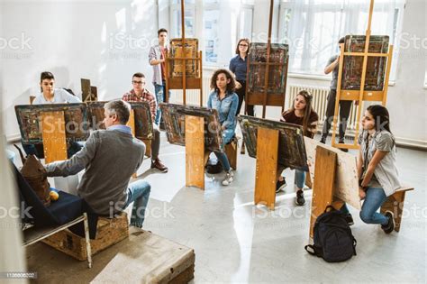 Large Group Of Students Having An Art Class With Their Teacher In A