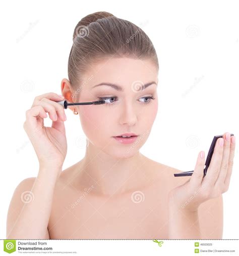 Portrait Of Young Beautiful Woman Applying Mascara On Her Eyelashes
