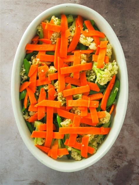 A Medley Of Crunchy Vegetables Topped With Garlic Bread Crumbs And