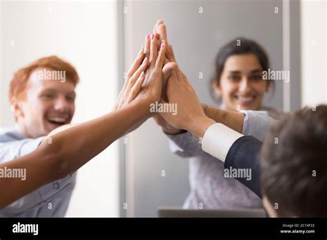 Happy Diverse Employees Giving High Five Celebrating Success Stock