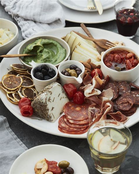 While you can almost never go wrong with dishes like tacos or barbecue, it turns there's an even better way to pull off an easy dinner party on a tight budget that will blow away your friends: Spanish Tapas Board from www.whatsgabycooking.com ...