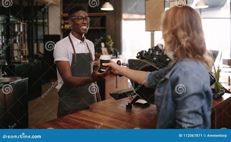 Barista Serving Customers Inside A Coffee Shop Stock Image Image Of