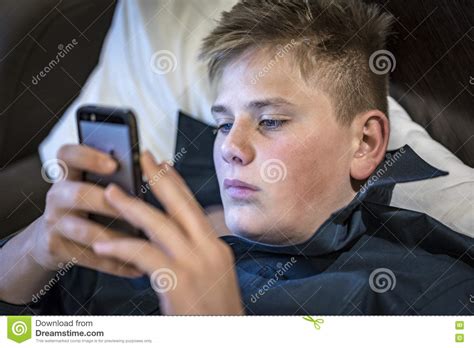 Young Teenage Boy Reading A Text Message Stock Photo Image Of Message
