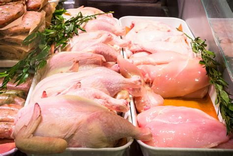 Fresh Chicken On Display In A Meat Market Counter Stock Photo