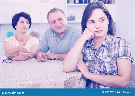 Mature Parents Listening To Daughter And Trying To Help Stock Image