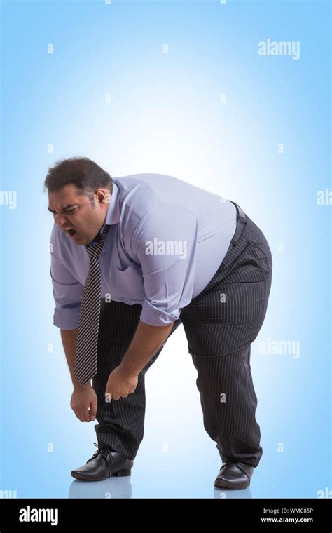 Overweight Man Bent Over Cartoon Vector Clipart Friendlystock Ph