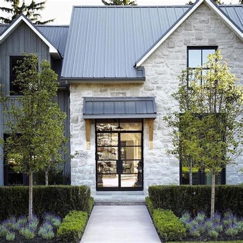 Gorgeous White Washed Stone Gives The Traditional Exterior Of This Home