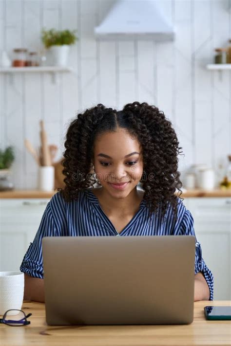 African American Teen Girl College Student Learning Online On Laptop