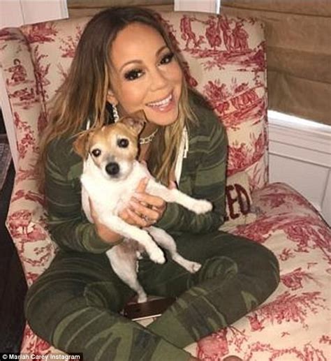 Mariah Carey cuddles her pet pooches | Daily Mail Online