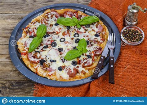 Homemade Pizza With Salami Mozzarella And Olives Stock Image Image