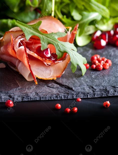 Sliced Prosciutto With Herbs And Pomegranate Seeds Photo Background And