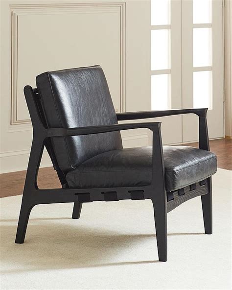 Leather accent chairs go great in front of the fireplace or in the corner of your home or office where you need a place to relax. Emeril Black Leather Wood Accent Chair