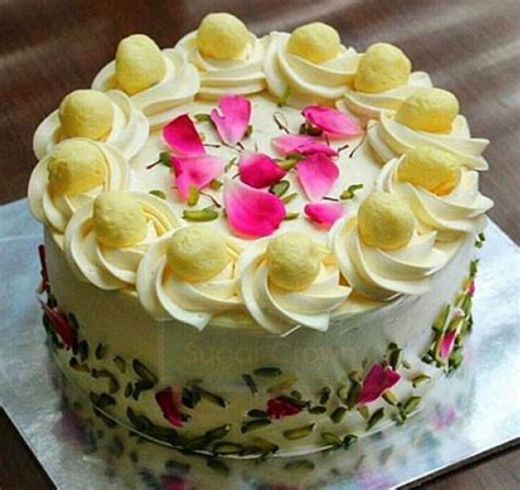 Add rasmalai milk, rasmalai pieces, and frosting between each layer. Rasmalai cake | Sugar Crown