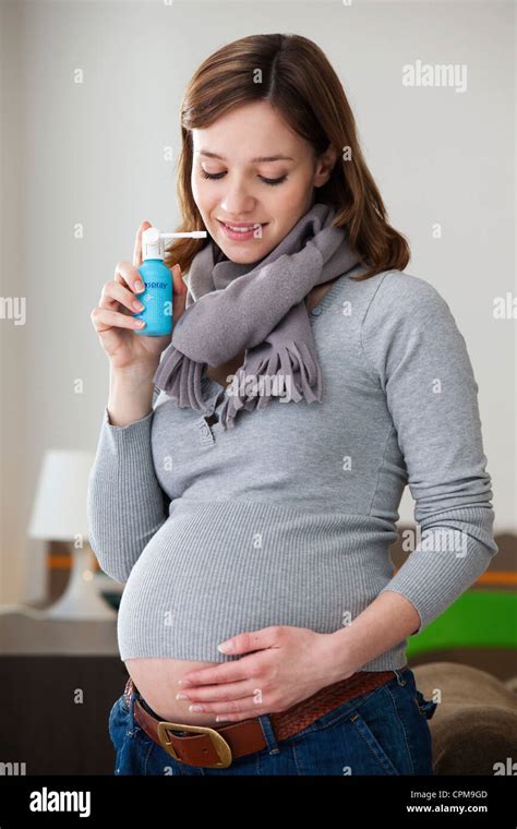Pregnant Woman Using Spray Stock Photo Alamy
