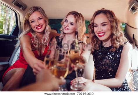 Pretty Women Having Party Limousine Car Stock Photo