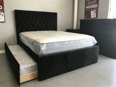 One on top of the other. Custom Queen size bed frame with twin trundle. All ...