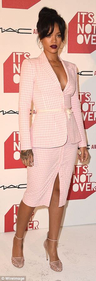rihanna takes the plunge and goes shirtless underneath a conservative pink checked suit daily