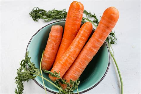 Top View Of Carrots In A Bowl White Background Close Up Creative
