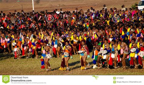 women in traditional costumes dancing at the umhlanga aka reed dance for their king lobamba