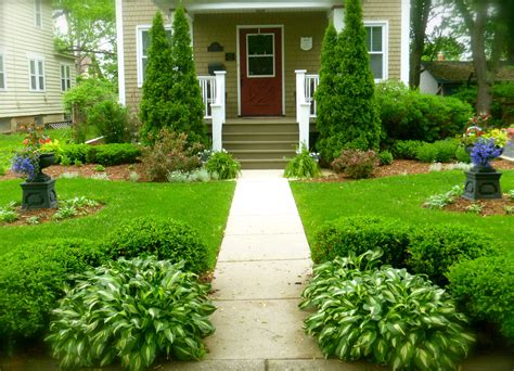 A front yard without characters and grass will create an uninviting walkway for your visitors. Symmetrical front yard, Lombard, IL | Walkway landscaping ...