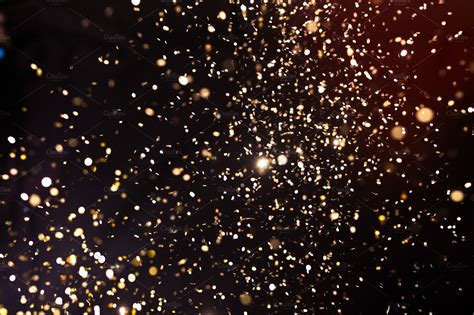 Gold glittering star dust trail sparkling particles on transparent background. Photo of golden glitter on a black background. Golden explosion ~ Photos ~ Creative Market
