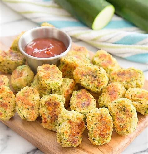 The zucchini flavor is completely masked by cheddar cheese and a little egg in the batter. Parmesan Zucchini Tots - Kirbie's Cravings