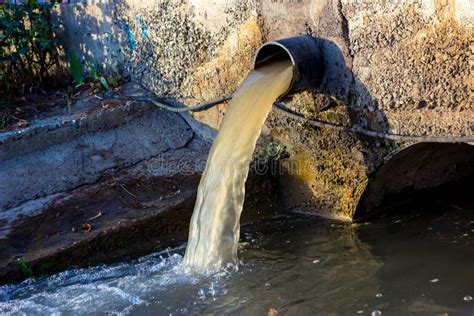 Wastewater Sewage Pipe Dumps The Dirty Contaminated Water Into The