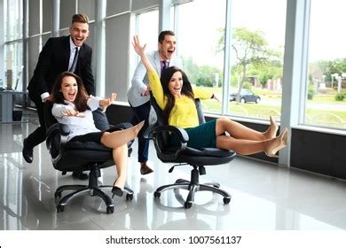 Cheerful Colleagues Having Fun Office Chairs Stock Photo 1007561137