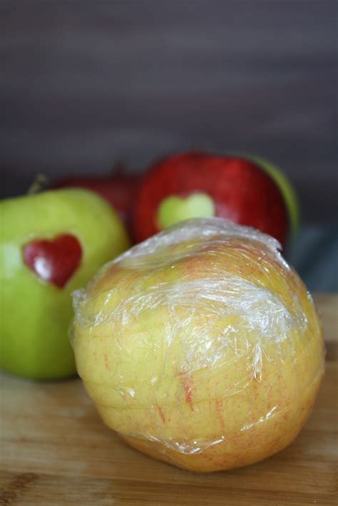 First, arrange the apple upright on a cutting board. How to Make Heart Shaped Apple Slices - Getty Stewart