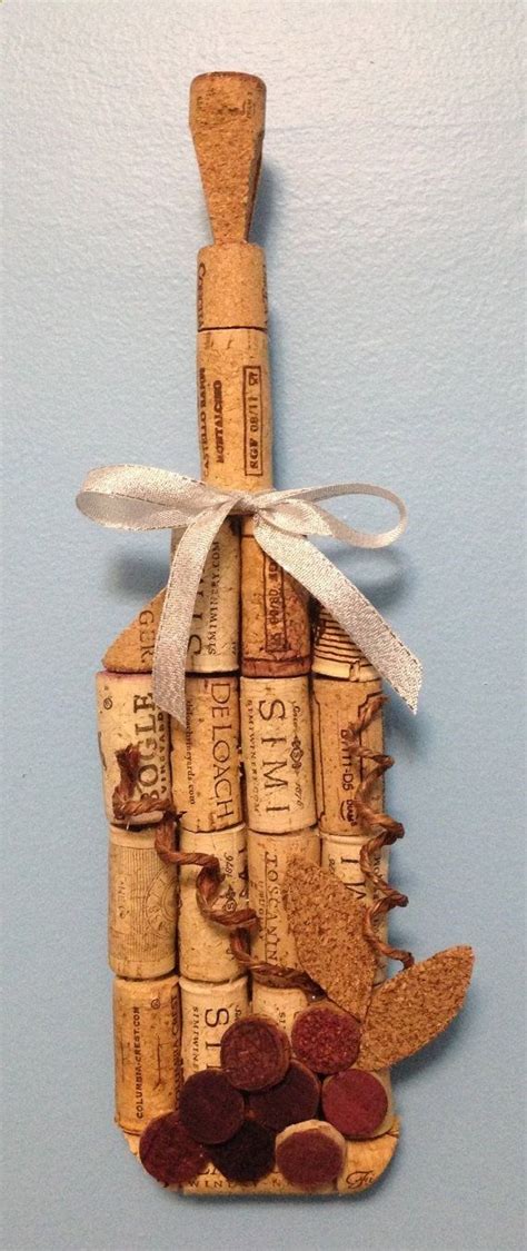 A Wine Cork House Ornament Hanging On A Wall