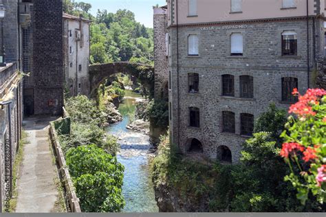 Magra River With The Ancient Bridge Between The Houses Of Bagnone A