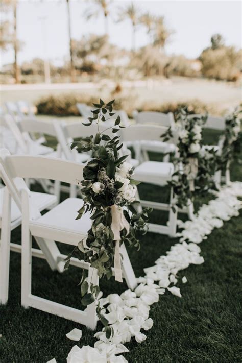 Ceremony Aisle Rose Petals And Chair Greenery With Soft Palette Floral